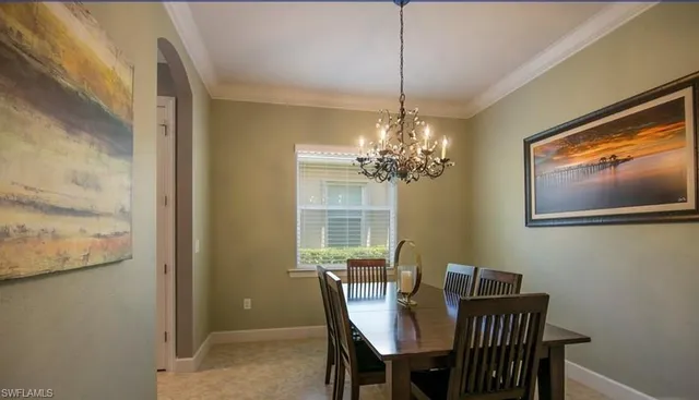 a kitchen with kitchen island granite countertop stainless steel appliances a sink stove and cabinets