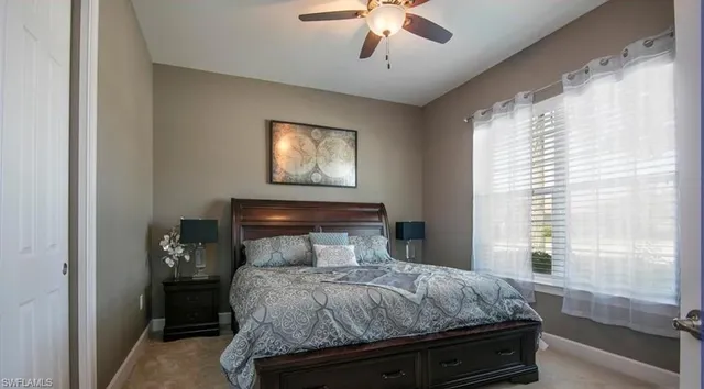 a bathroom with a granite countertop sink toilet and a mirror