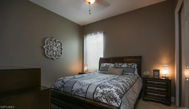 a dining room with furniture and chandelier