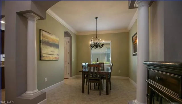 a living room with furniture a flat screen tv and a large window