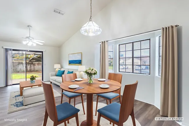 a view of a dining room with furniture window and outside view