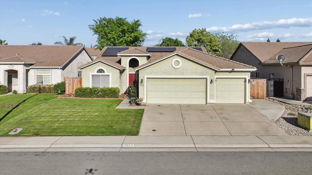 2013 Butterfield Lane Lincoln, CA 95648 - Photo 1 of 1 a front view of a house with a yard and garage