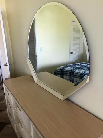 a view of swimming pool with outdoor seating and city view