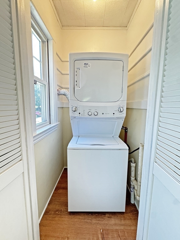 48 Harvard Street, Unit 1 Newton, MA 02460 - Photo 15 of 32 a utility room with dryer and washer