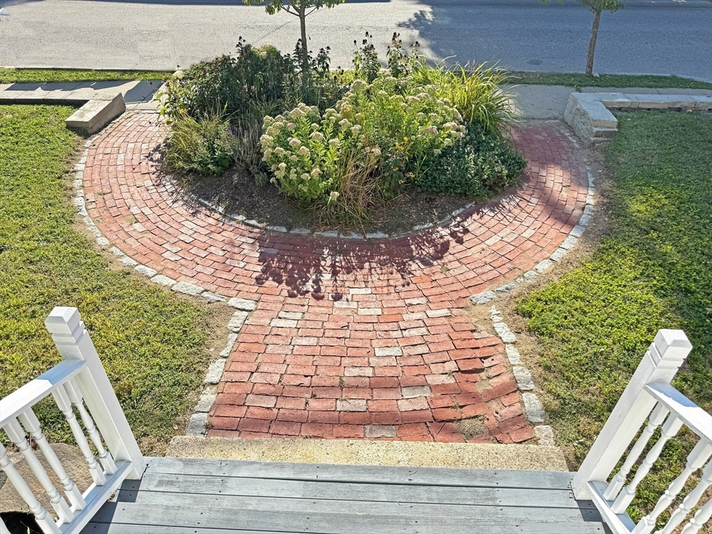 48 Harvard Street, Unit 1 Newton, MA 02460 - Photo 4 of 32 a view of a backyard with sitting area