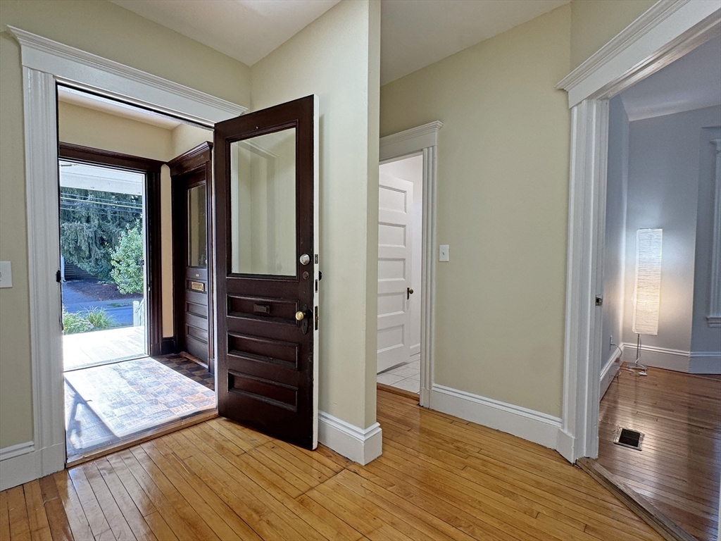 48 Harvard Street, Unit 1 Newton, MA 02460 - Photo 6 of 32 wooden floor and closet in a room