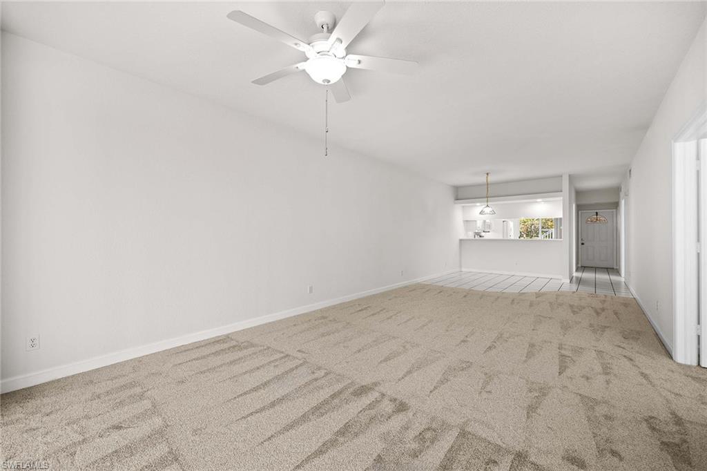 1625 Windy Pines Drive, Unit 5 Naples, FL 34112 - Photo 15 of 43 an empty room with fan and windows