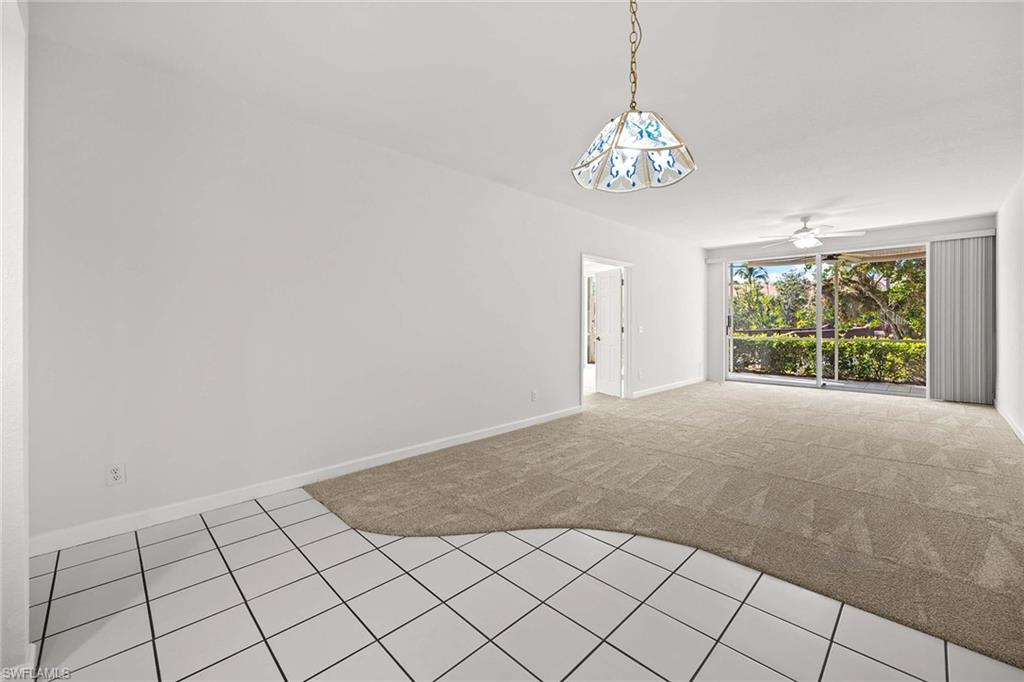 1625 Windy Pines Drive, Unit 5 Naples, FL 34112 - Photo 16 of 43 a view of an entryway with window