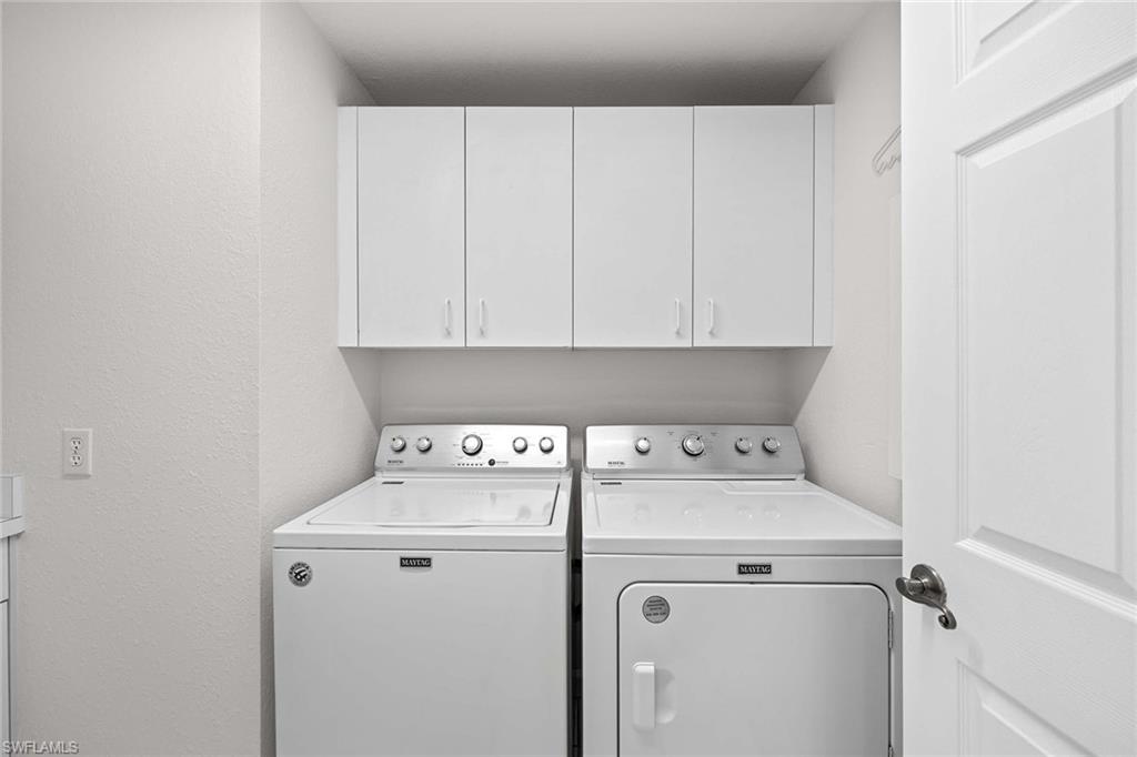 1625 Windy Pines Drive, Unit 5 Naples, FL 34112 - Photo 22 of 43 a utility room with dryer and washer