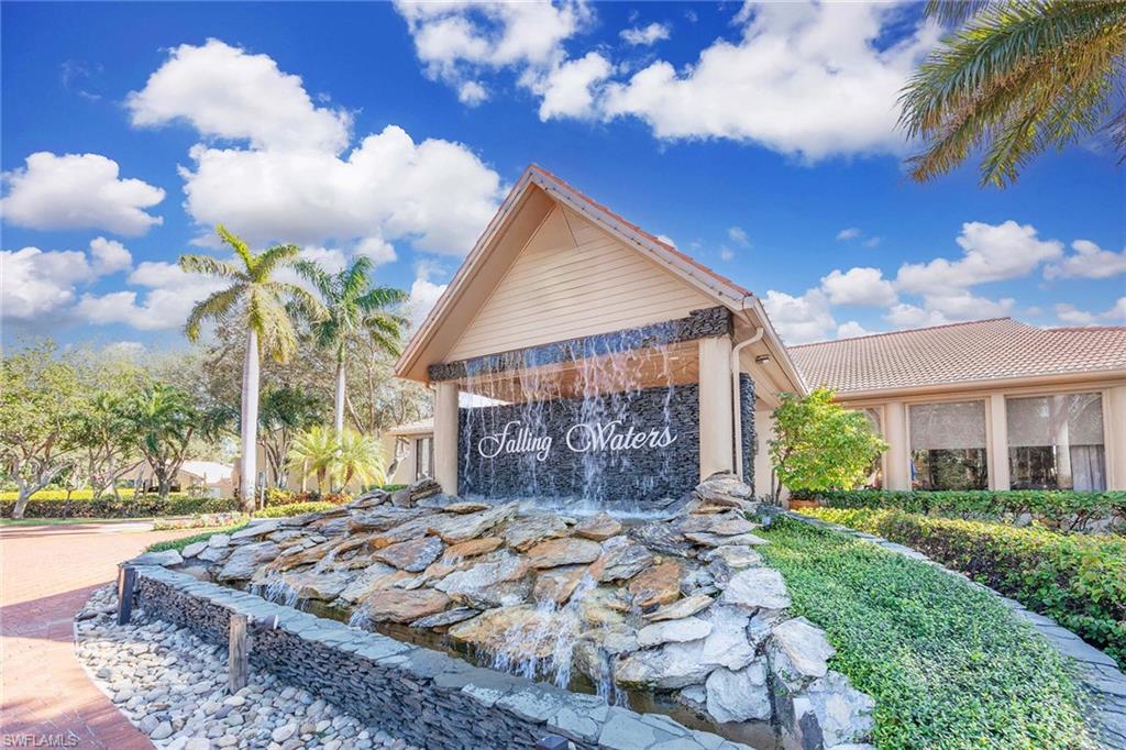 1625 Windy Pines Drive, Unit 5 Naples, FL 34112 - Photo 31 of 43 a view of a house with a yard and pathway