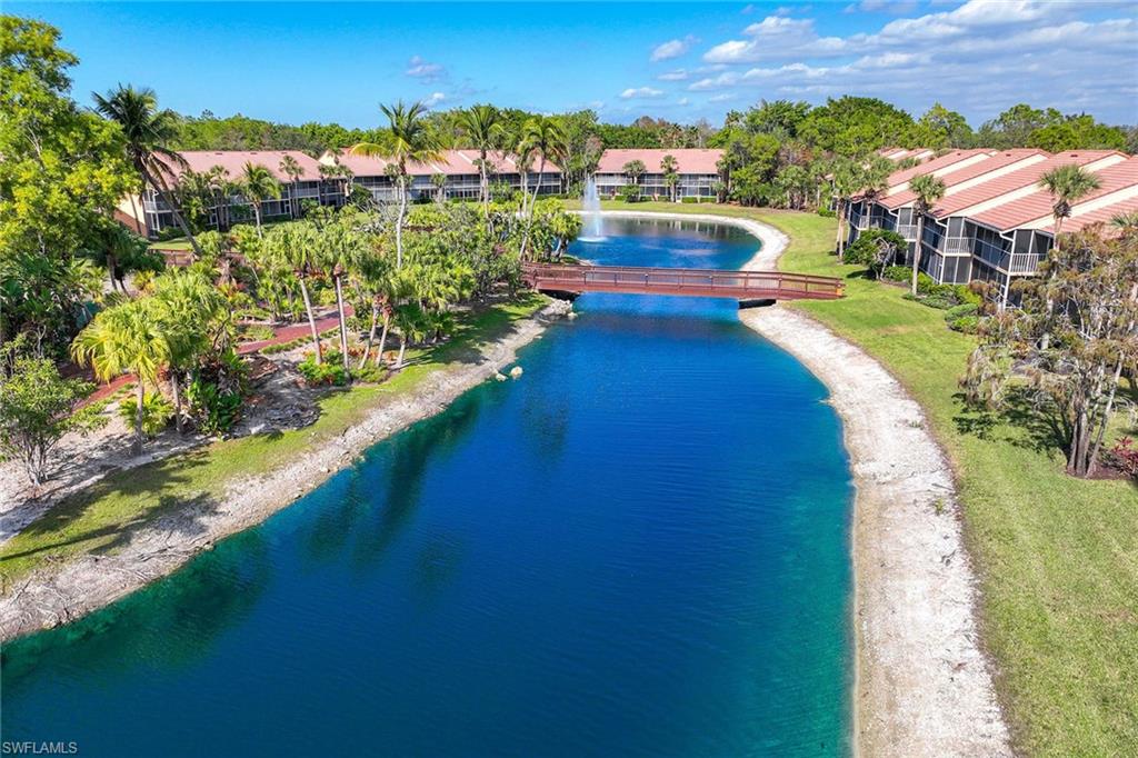 1625 Windy Pines Drive, Unit 5 Naples, FL 34112 - Photo 33 of 43 a view of a lake with a city