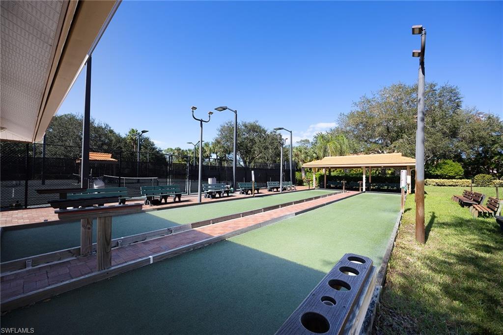 1625 Windy Pines Drive, Unit 5 Naples, FL 34112 - Photo 37 of 43 a view of a patio with swimming pool