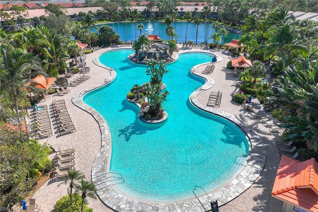 1625 Windy Pines Drive, Unit 5 Naples, FL 34112 - Photo 4 of 43 a view of a swimming pool with sitting area
