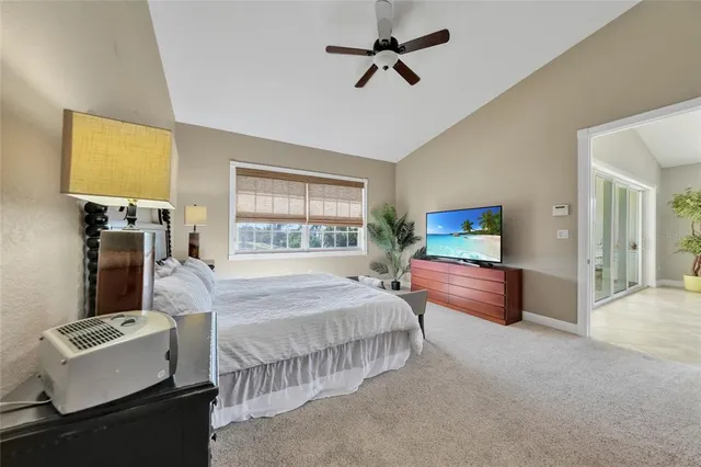 a bedroom with bed and a couch