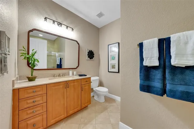a spacious bathroom with a double vanity sink and a mirror