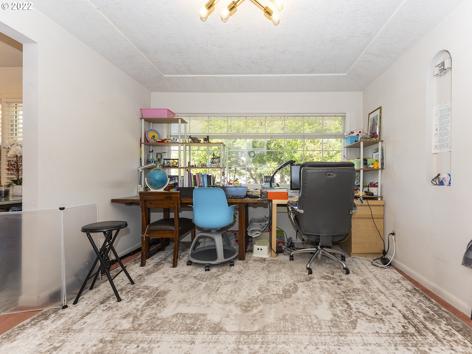 4530 Southwest 110th Avenue Beaverton, OR 97005 - Photo 11 of 32 a view of a workspace with furniture and a window