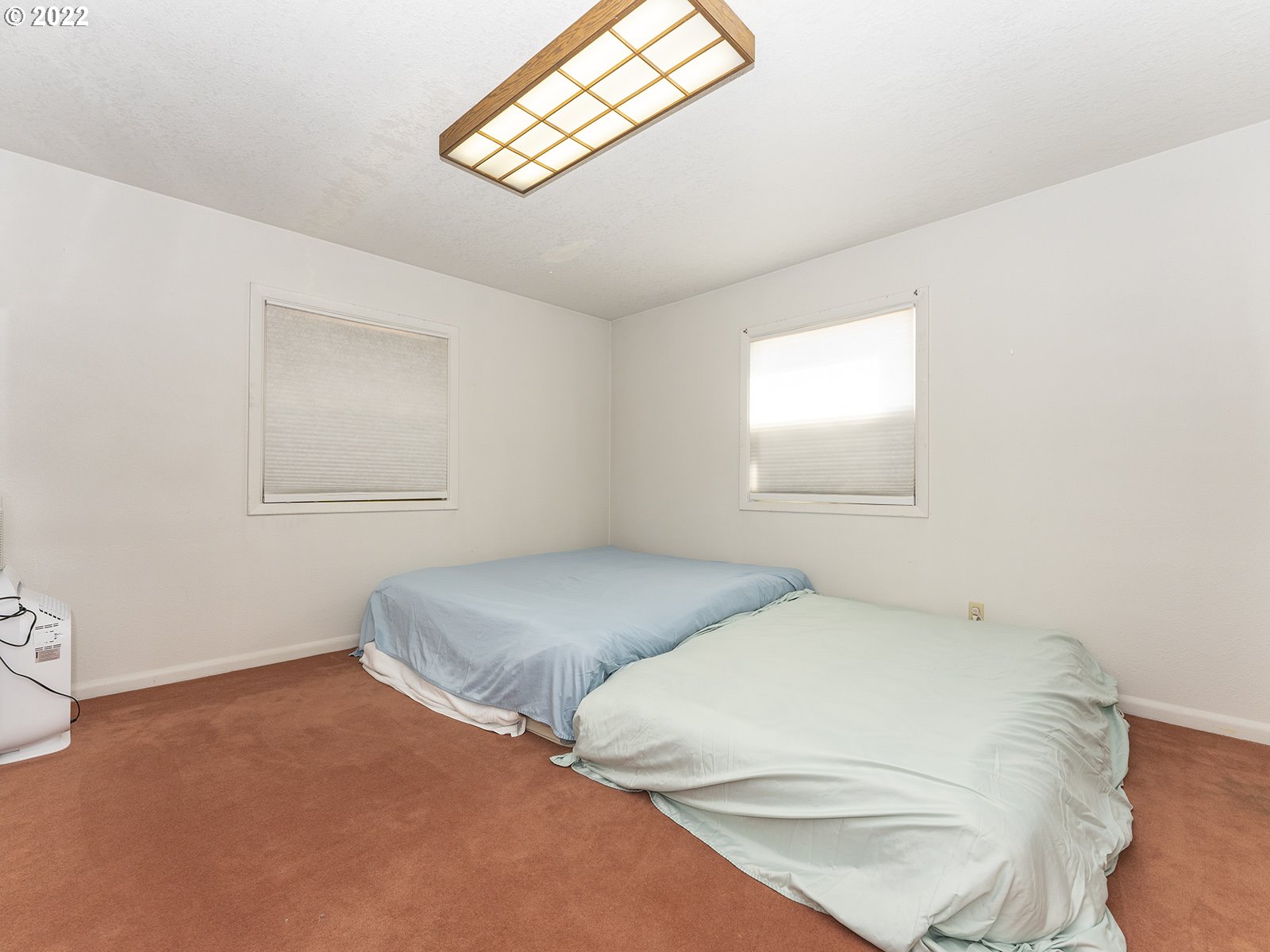 4530 Southwest 110th Avenue Beaverton, OR 97005 - Photo 17 of 32 a bedroom with a bed and a window