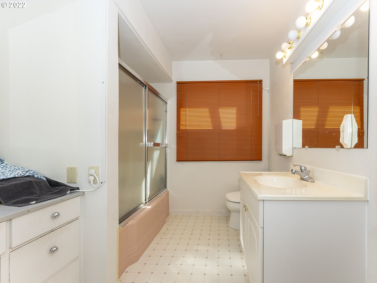 4530 Southwest 110th Avenue Beaverton, OR 97005 - Photo 18 of 32 a bathroom with a sink a toilet and shower