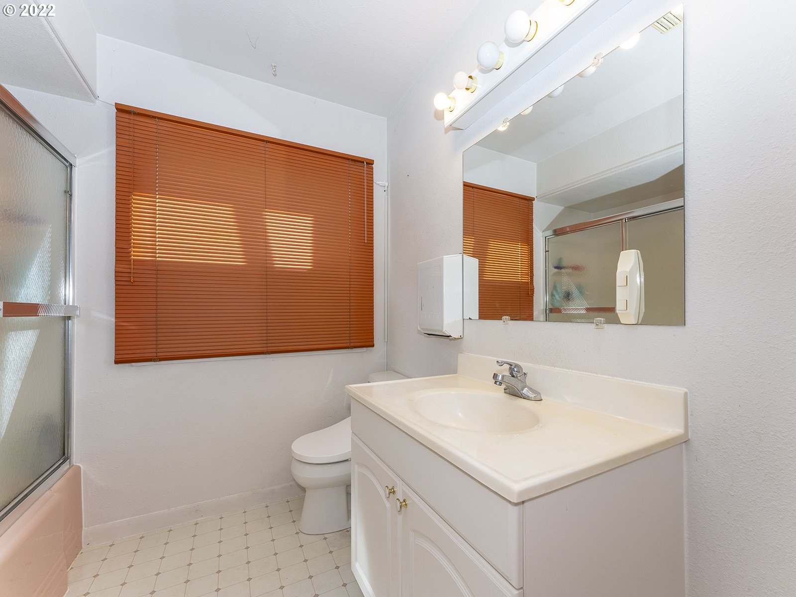 4530 Southwest 110th Avenue Beaverton, OR 97005 - Photo 19 of 32 a bathroom with a sink a toilet and mirror