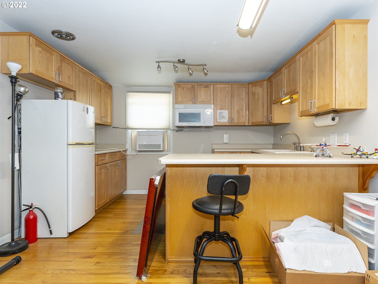 4530 Southwest 110th Avenue Beaverton, OR 97005 - Photo 20 of 32 a kitchen with stainless steel appliances granite countertop a refrigerator and a stove top oven
