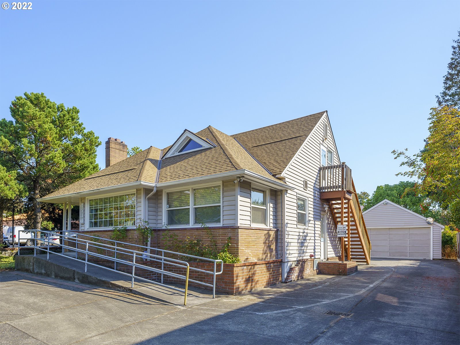 4530 Southwest 110th Avenue Beaverton, OR 97005 - Photo 2 of 32 a front view of a house with a yard