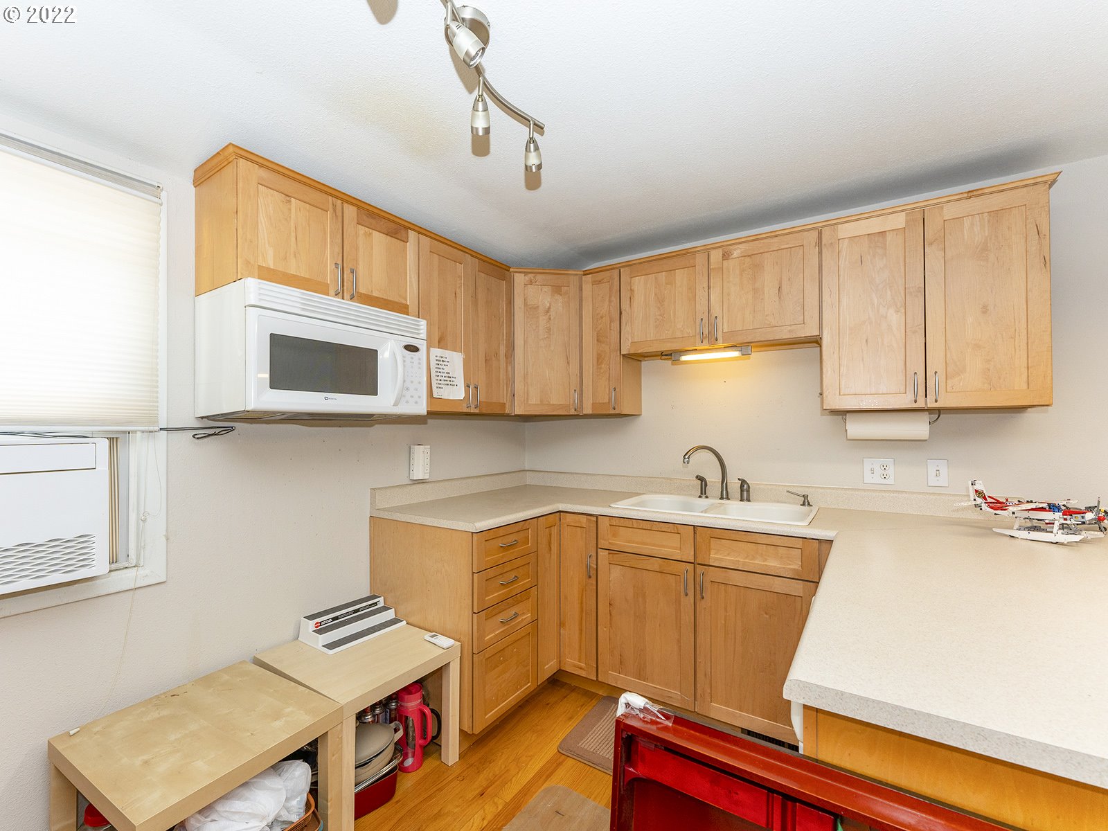 4530 Southwest 110th Avenue Beaverton, OR 97005 - Photo 21 of 32 a kitchen with a sink cabinets and window