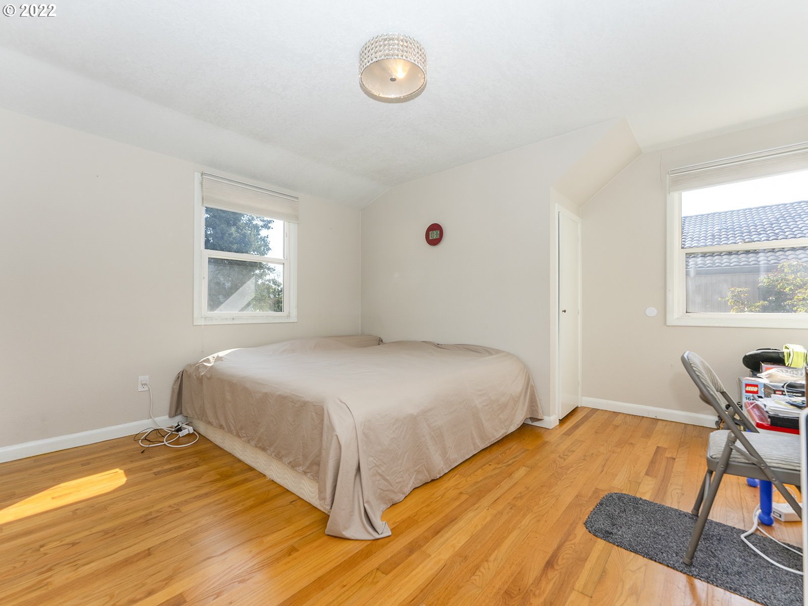 4530 Southwest 110th Avenue Beaverton, OR 97005 - Photo 26 of 32 a bedroom with a bed and a window