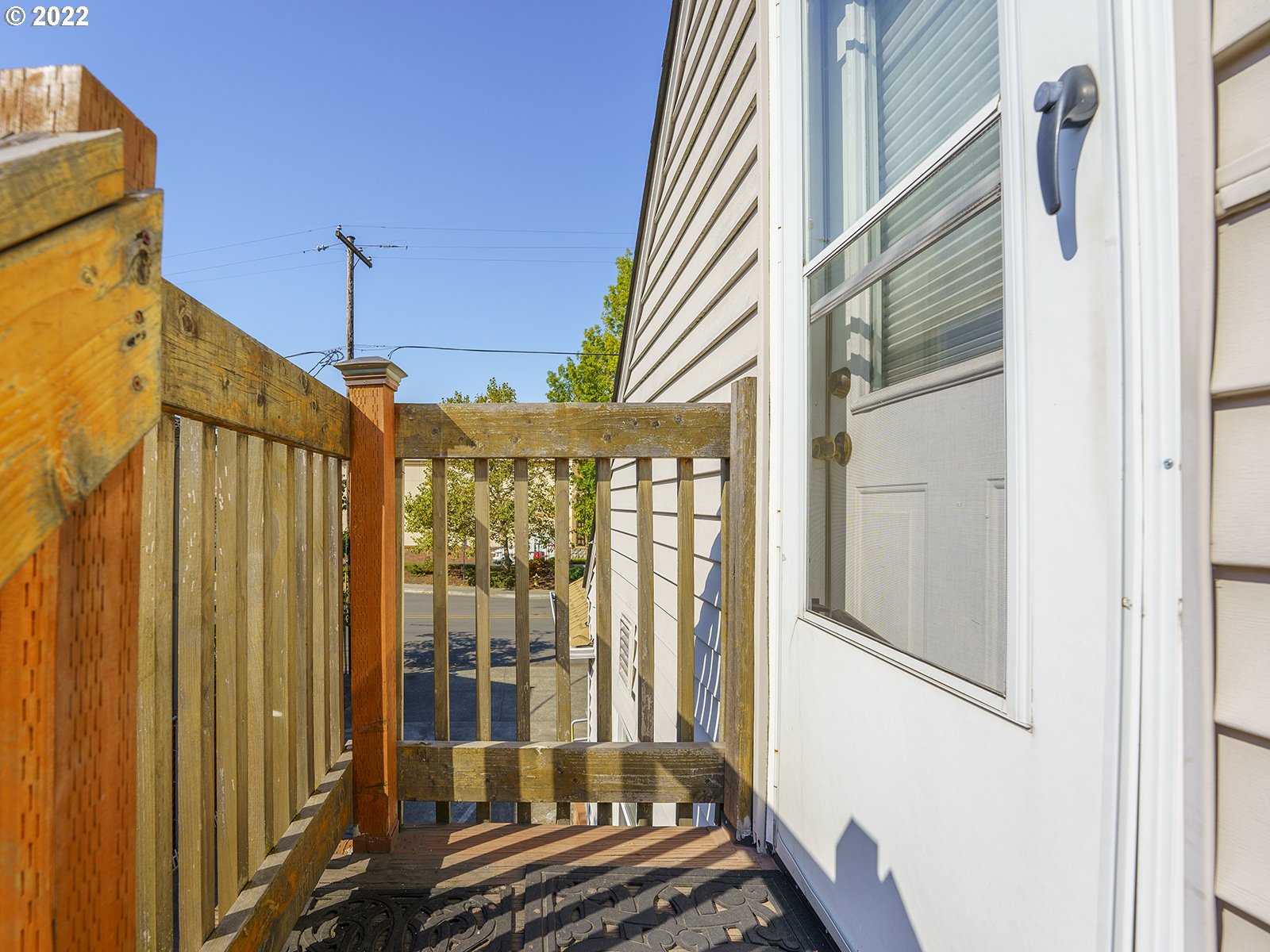 4530 Southwest 110th Avenue Beaverton, OR 97005 - Photo 28 of 32 a view of a balcony with wooden floor and door