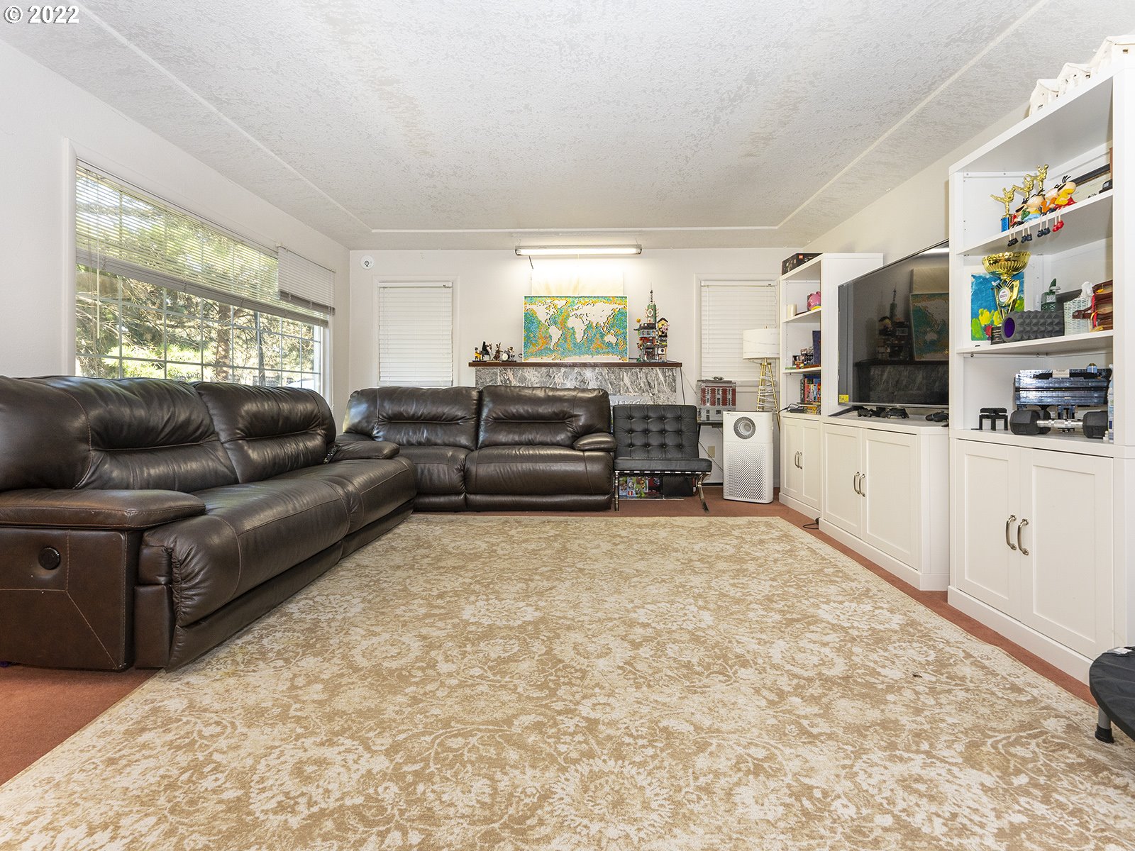 4530 Southwest 110th Avenue Beaverton, OR 97005 - Photo 6 of 32 a living room with furniture and a flat screen tv