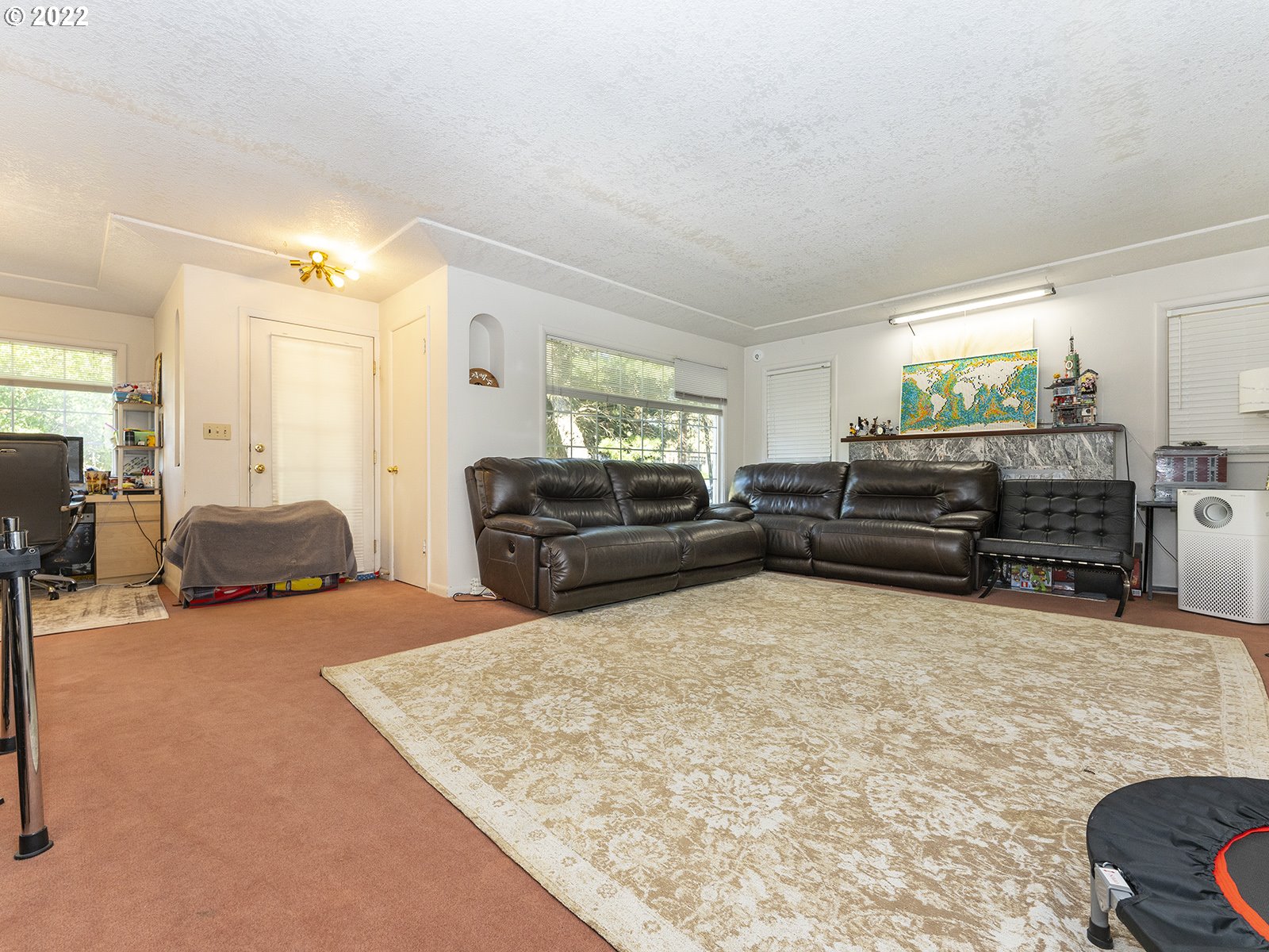 4530 Southwest 110th Avenue Beaverton, OR 97005 - Photo 7 of 32 a living room with furniture and a flat screen tv