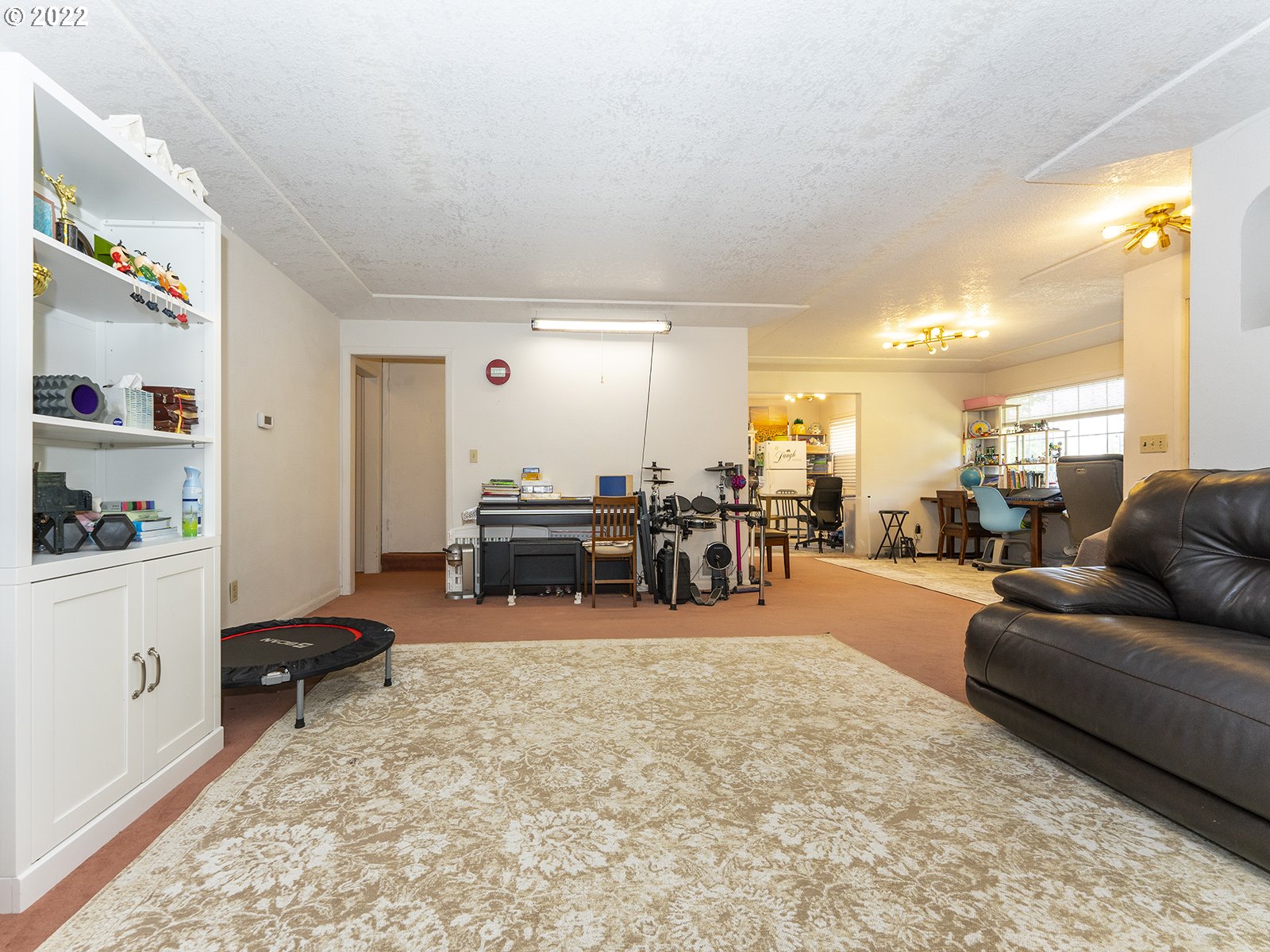 4530 Southwest 110th Avenue Beaverton, OR 97005 - Photo 8 of 32 a living room with furniture and a flat screen tv