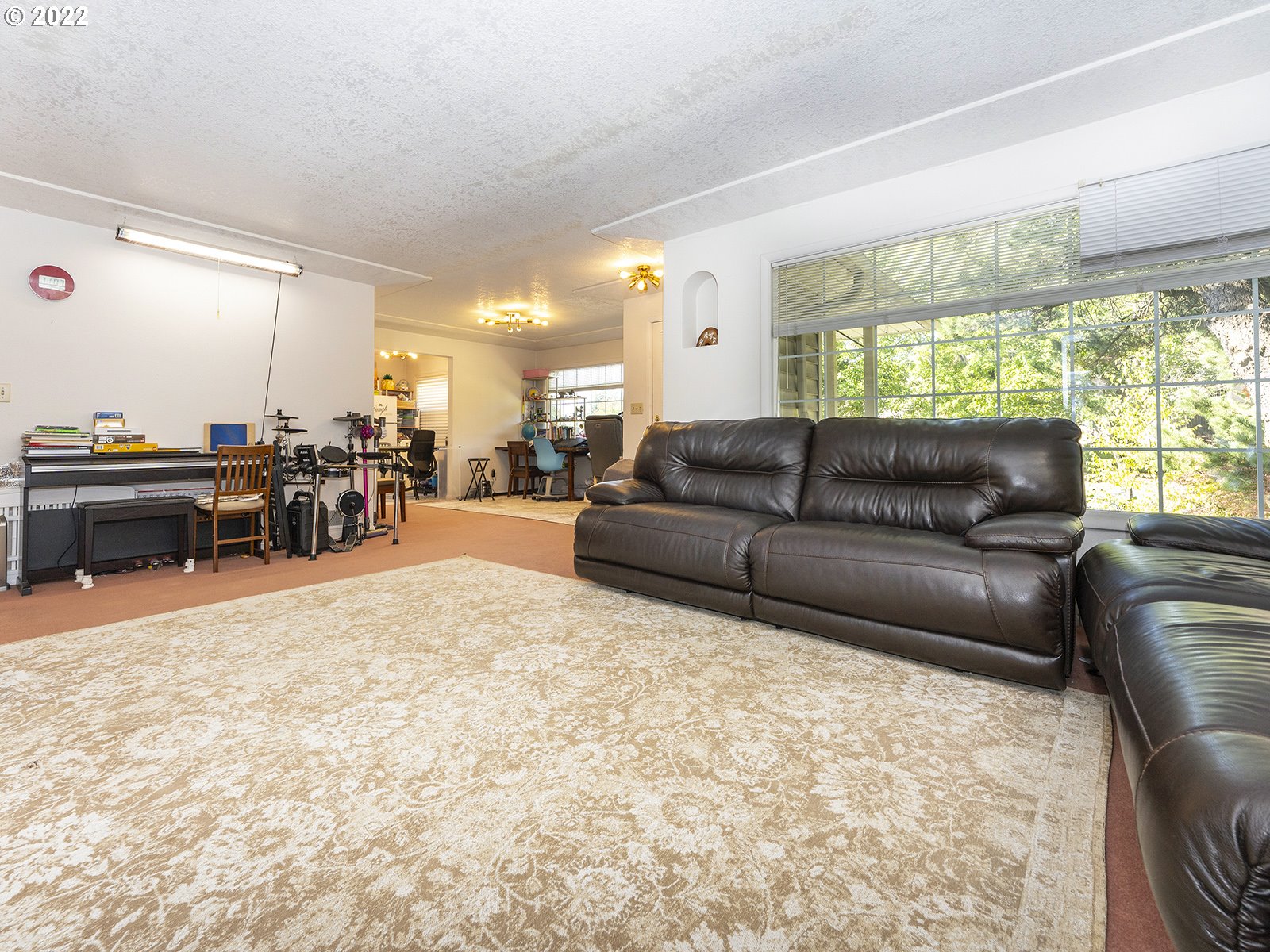 4530 Southwest 110th Avenue Beaverton, OR 97005 - Photo 9 of 32 a living room with furniture and a large window