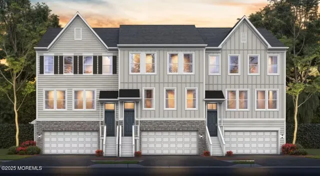 a view of a white house with large windows and a road