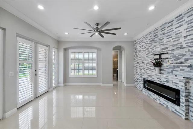 wooden floor in an empty room with a fireplace