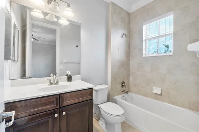a bathroom with a sink mirror toilet and bathtub