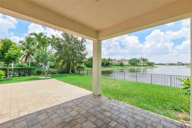 a view of lake with a big yard