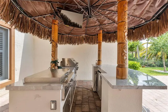 a view of a house with yard and sitting area