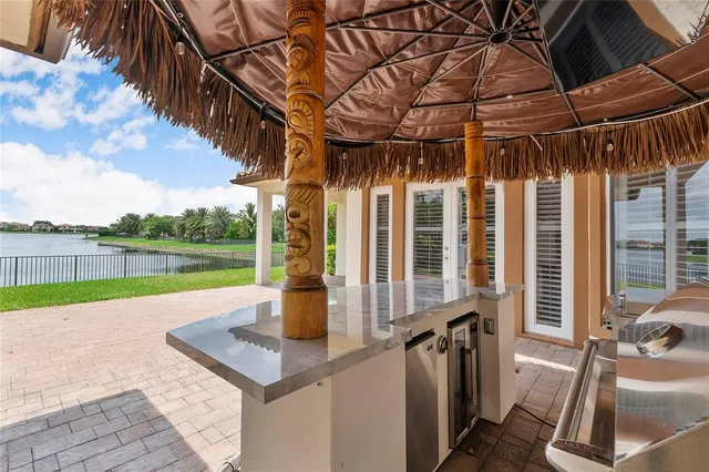 a view of swimming pool with a patio and a yard