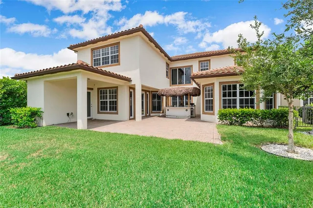 a front view of a house with a yard and porch
