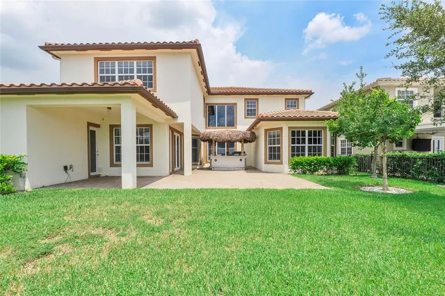 a front view of a house with a garden and porch