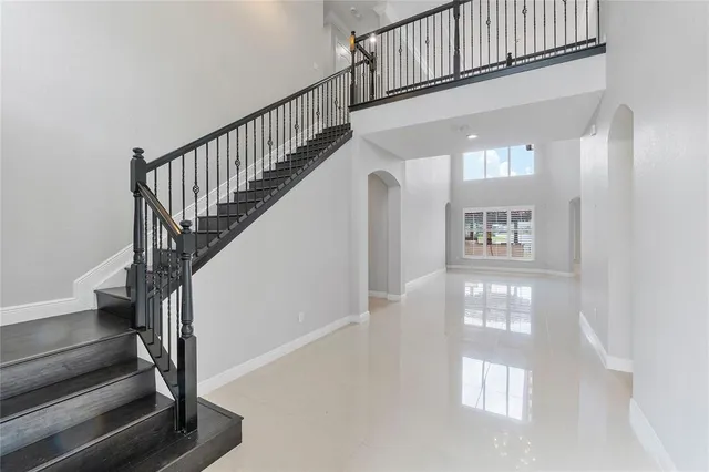 a view of entryway with wooden floor and a front door