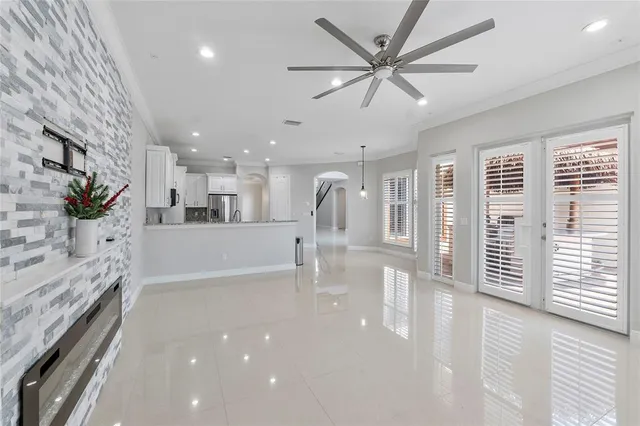 a view of a living room and a ceiling fan