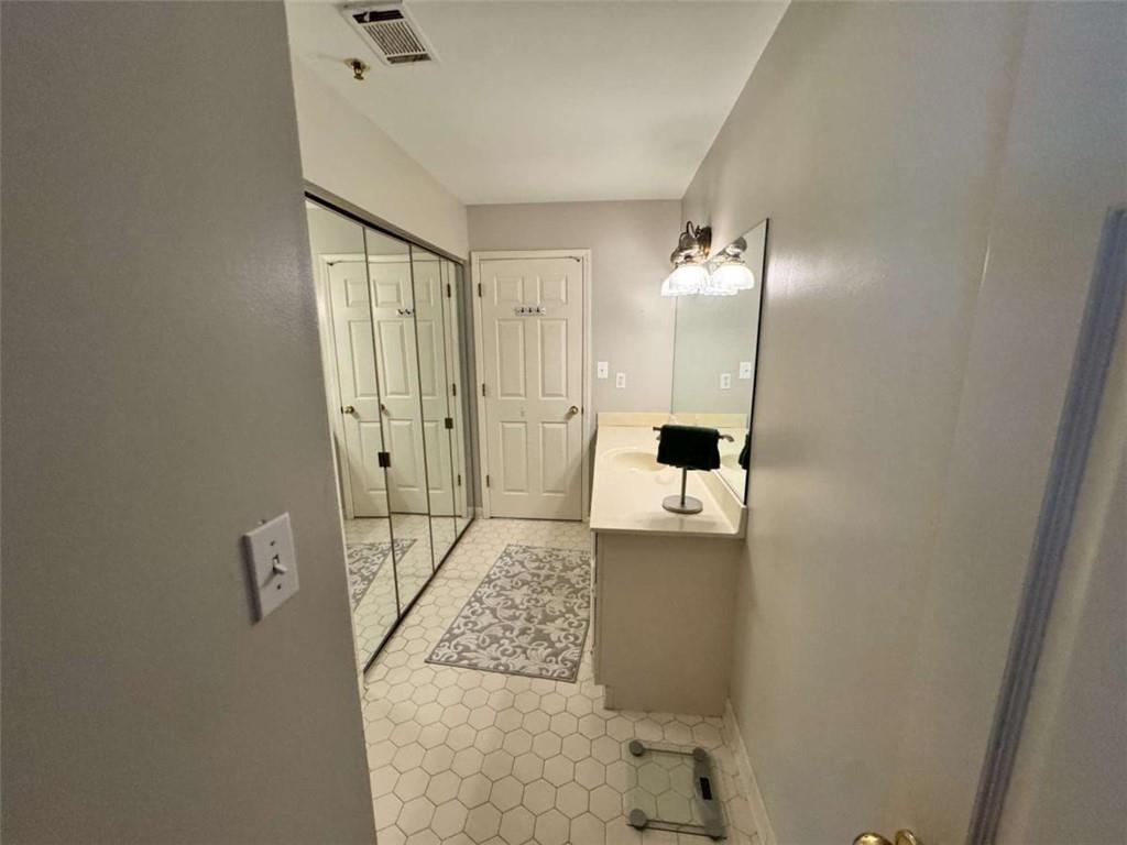 3201 Lenox Road Northeast, Unit 2 Atlanta, GA 30324 - Photo 14 of 39 a bathroom with a shower and mirror