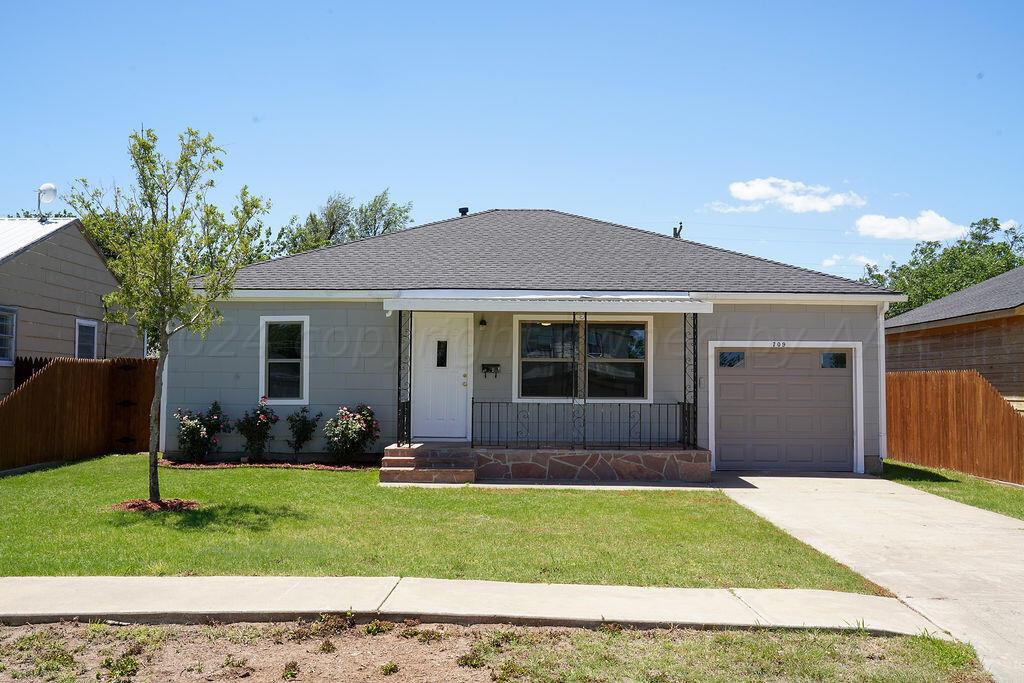 front view of a house with a yard