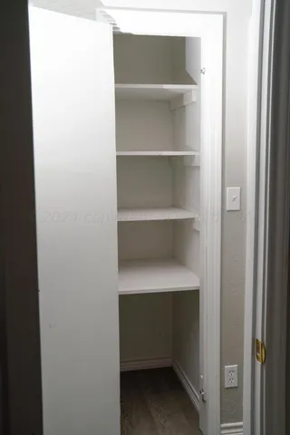 a view of an empty walk in closet