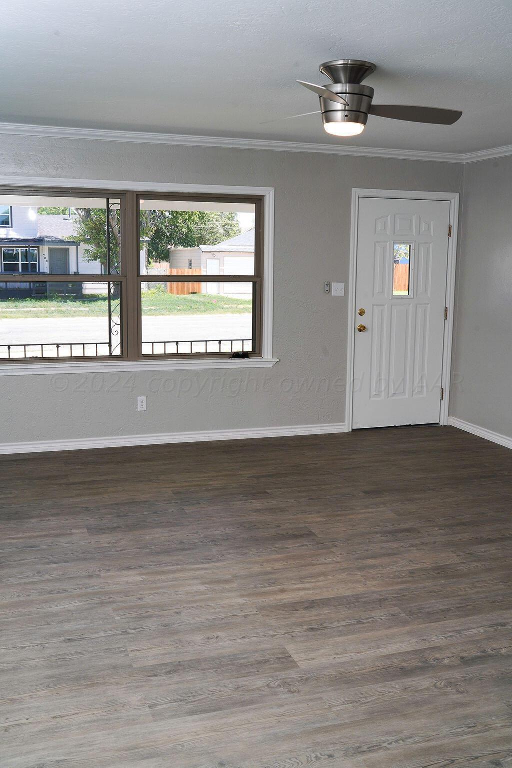 709 North Wells Street Pampa, TX 79065 - Photo 5 of 26 a view of an empty room with a window
