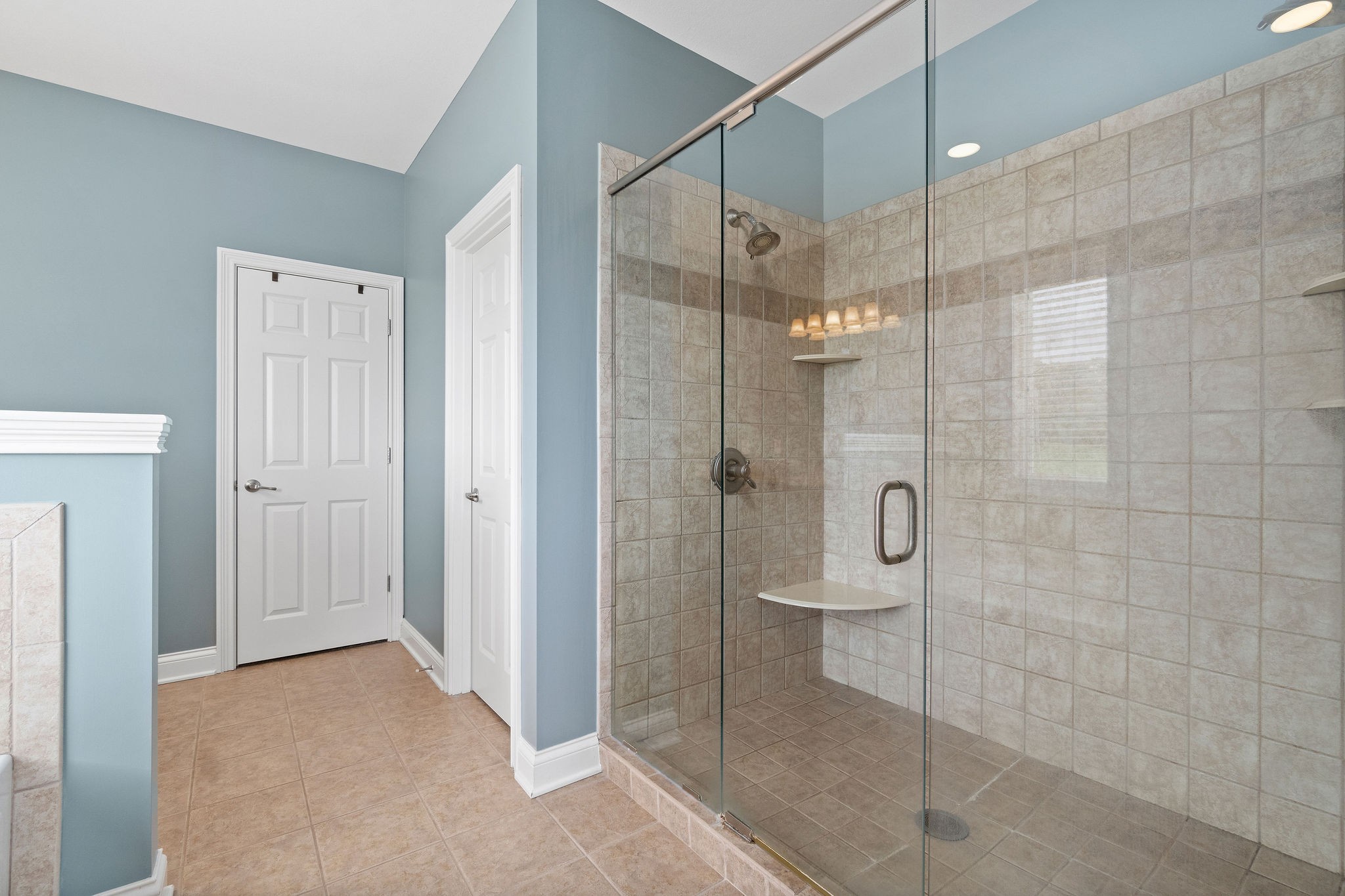 701 7 Mile Ferry Road Cunningham, TN 37052 - Photo 17 of 36 a bathroom that has a glass shower door