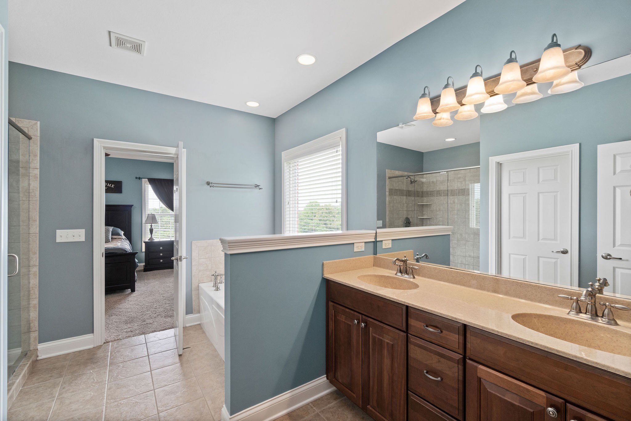 701 7 Mile Ferry Road Cunningham, TN 37052 - Photo 19 of 36 a spacious bathroom with a double vanity sink and a mirror