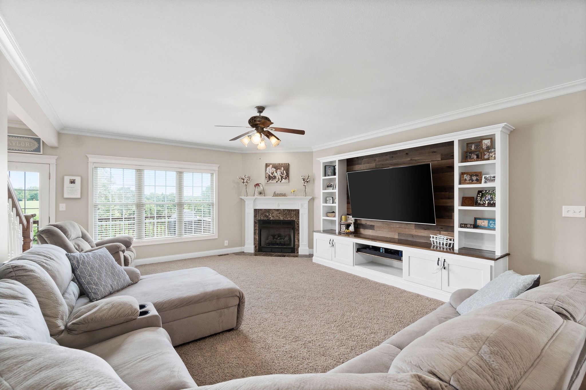 701 7 Mile Ferry Road Cunningham, TN 37052 - Photo 3 of 36 a living room with furniture a fireplace and a flat screen tv