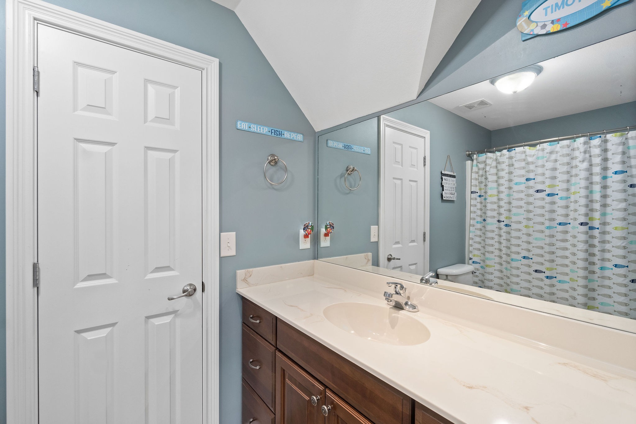 701 7 Mile Ferry Road Cunningham, TN 37052 - Photo 25 of 36 a bathroom with a sink and a mirror